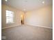 Bright bedroom featuring neutral carpeting and a window at 7942 Beaumont Green Pl, Indianapolis, IN 46250