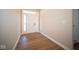 Bright and spacious entryway with wood-look flooring and neutral walls at 7942 Beaumont Green Pl, Indianapolis, IN 46250
