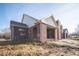Brick house exterior showcasing a covered patio area at 7942 Beaumont Green Pl, Indianapolis, IN 46250