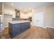 Modern kitchen with island and stainless steel appliances at 7942 Beaumont Green Pl, Indianapolis, IN 46250