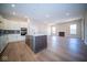 Open concept kitchen and living area with hardwood floors at 7942 Beaumont Green Pl, Indianapolis, IN 46250