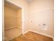Laundry room with built-in shelving and space for a washer and dryer at 7942 Beaumont Green Pl, Indianapolis, IN 46250