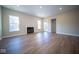 Large living room with hardwood floors, fireplace, and access to the backyard at 7942 Beaumont Green Pl, Indianapolis, IN 46250