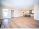 Open concept living room and kitchen with hardwood floors at 7942 Beaumont Green Pl, Indianapolis, IN 46250