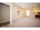 Spacious main bedroom with carpeting, large windows, and ensuite bathroom access at 7942 Beaumont Green Pl, Indianapolis, IN 46250