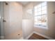 Walk in shower with marble tile and glass enclosure at 7942 Beaumont Green Pl, Indianapolis, IN 46250