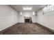 Unfinished basement with fireplace, hardwood floors, and ample space at 6463 N Illinois N St, Indianapolis, IN 46260