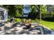 Spacious patio with fire pit and seating area, adjacent to home at 6463 N Illinois N St, Indianapolis, IN 46260