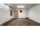 Unfinished basement with a door to another room and hardwood floors at 6463 N Illinois N St, Indianapolis, IN 46260