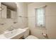 Simple bathroom with white sink, shower, and window with blinds at 6463 N Illinois N St, Indianapolis, IN 46260