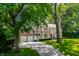 Brick house with attached garage, landscaping, and a paved driveway at 6463 N Illinois N St, Indianapolis, IN 46260