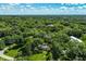 An aerial view showcasing a charming home surrounded by trees at 6463 N Illinois N St, Indianapolis, IN 46260