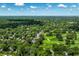 Aerial view of a residential area adjacent to a golf course, showcasing a green landscape at 6463 N Illinois N St, Indianapolis, IN 46260