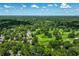 Aerial view of a neighborhood featuring a golf course and tree-lined streets at 6463 N Illinois N St, Indianapolis, IN 46260