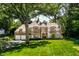 Stunning two-story brick home nestled amongst lush trees at 6463 N Illinois N St, Indianapolis, IN 46260
