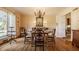 Classic dining room with a round table and chandelier at 6463 N Illinois N St, Indianapolis, IN 46260