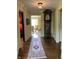 Long hallway with hardwood floors, runner rug, and grandfather clock at 6463 N Illinois N St, Indianapolis, IN 46260