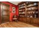 Home library with wood built-ins and red walls at 6463 N Illinois N St, Indianapolis, IN 46260