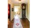 Long hallway with hardwood floors, runner rug, and grandfather clock at 6463 N Illinois N St, Indianapolis, IN 46260
