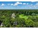 Aerial view showcasing homes near a golf course, offering a luxurious and peaceful neighborhood at 6463 N Illinois N St, Indianapolis, IN 46260