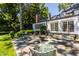 Stone patio with fire pit and seating area, near home's back entrance at 6463 N Illinois N St, Indianapolis, IN 46260