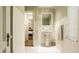Charming bathroom with pedestal sink, white tile, and a view into a bedroom at 6463 N Illinois N St, Indianapolis, IN 46260