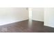 Living room with hardwood floors and access to other rooms at 3720 Breen Dr, Indianapolis, IN 46235