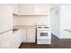 Kitchen with white cabinets, gas range, and granite countertops at 3720 Breen Dr, Indianapolis, IN 46235