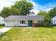 Charming ranch home with a well-maintained lawn and attached garage at 3720 Breen Dr, Indianapolis, IN 46235