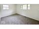 Bedroom featuring grey carpet and multiple windows at 3720 Breen Dr, Indianapolis, IN 46235