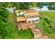 Lake house with large deck and patio area at 409 W Lakeview Dr, Nineveh, IN 46164