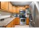 Kitchen with stainless steel appliances and wood cabinets at 409 W Lakeview Dr, Nineveh, IN 46164