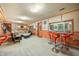 Finished basement with seating area, bar stools, and lake view at 409 W Lakeview Dr, Nineveh, IN 46164