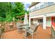 Deck with seating area and glass-top table for outdoor dining at 409 W Lakeview Dr, Nineveh, IN 46164