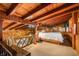 Loft bedroom with wood-beamed ceiling and a king-size bed at 409 W Lakeview Dr, Nineveh, IN 46164