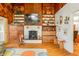 A wood-burning fireplace with built-in shelving at 409 W Lakeview Dr, Nineveh, IN 46164