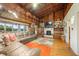 Spacious living room with a cozy fireplace and hardwood floors at 409 W Lakeview Dr, Nineveh, IN 46164