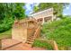 Lakefront home with multi-level decks and stairs leading to the water at 409 W Lakeview Dr, Nineveh, IN 46164