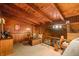 Loft bedroom with wood-beamed ceiling, a dresser, and a king-size bed at 409 W Lakeview Dr, Nineveh, IN 46164