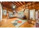 Living room with hardwood floors, a fireplace, and a rocking chair at 409 W Lakeview Dr, Nineveh, IN 46164