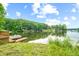 Stunning view of a calm lake, surrounded by lush greenery and houses at 409 W Lakeview Dr, Nineveh, IN 46164