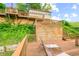 Multi-level deck with lake views and stairs leading to the house at 409 W Lakeview Dr, Nineveh, IN 46164