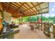 Relaxing covered deck with seating and lake views at 409 W Lakeview Dr, Nineveh, IN 46164