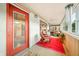 Relaxing screened porch with rocking chairs and red rug at 409 W Lakeview Dr, Nineveh, IN 46164