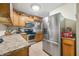 Kitchen featuring stainless steel appliances and wood cabinets at 409 W Lakeview Dr, Nineveh, IN 46164