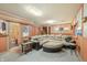 Finished basement features a large sectional sofa and a wet bar at 409 W Lakeview Dr, Nineveh, IN 46164