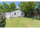 Large backyard with a grassy area and wooden fence at 929 Olin Ave, Indianapolis, IN 46222