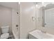 Clean bathroom with a bathtub, shower, and vanity at 929 Olin Ave, Indianapolis, IN 46222