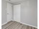 Simple bedroom with grey walls and wood-look flooring at 929 Olin Ave, Indianapolis, IN 46222