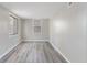 Simple bedroom with grey walls and wood-look flooring at 929 Olin Ave, Indianapolis, IN 46222